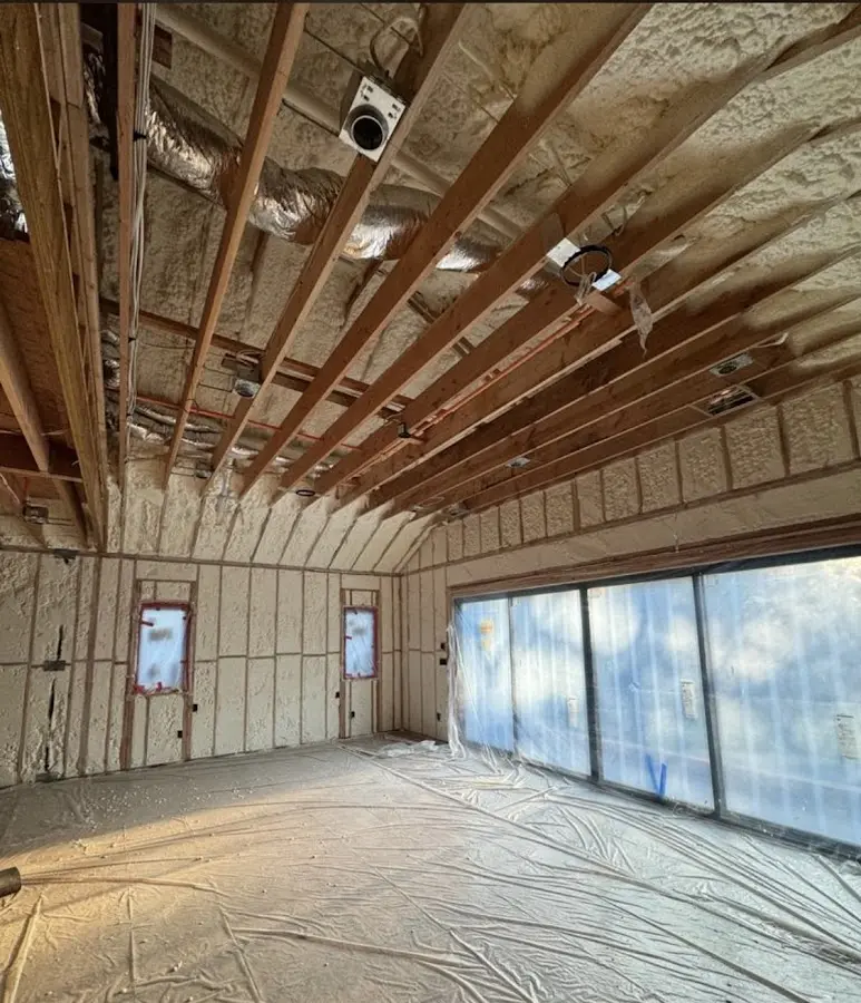 Interior walls and ceiling insulated with spray foam during new construction in South Lyon